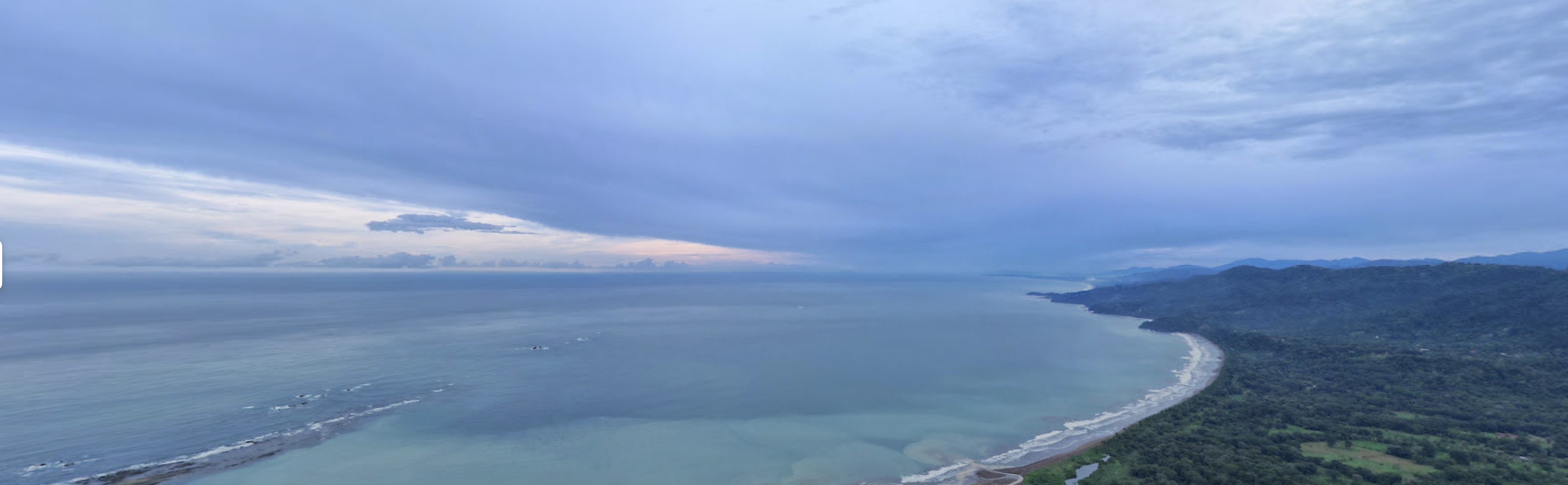 Sweeping panorama of Ballena Bay at dusk